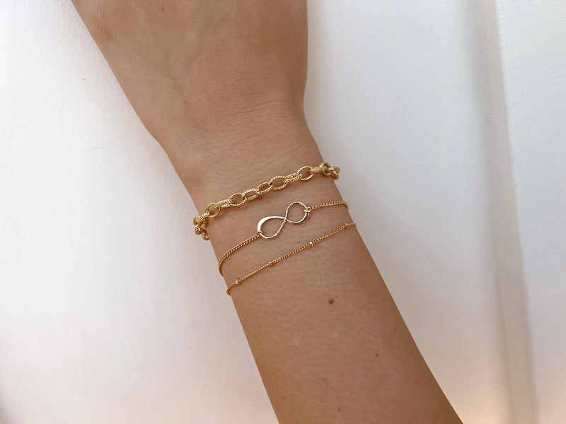 Buy Designbox Gold Tone CZ Diamond Studded Infinity Bracelet with  Adjustable String Online
